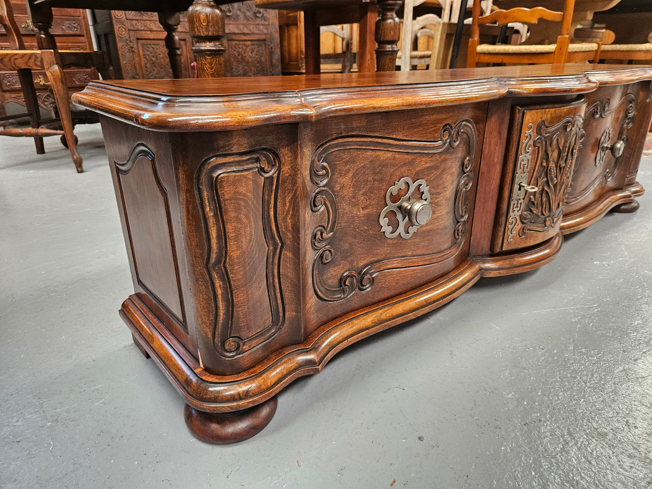 Appealing French Louis XVth style walnut converted TV unit. Central carved door & 2 Sliding Cupboards. In good condition.