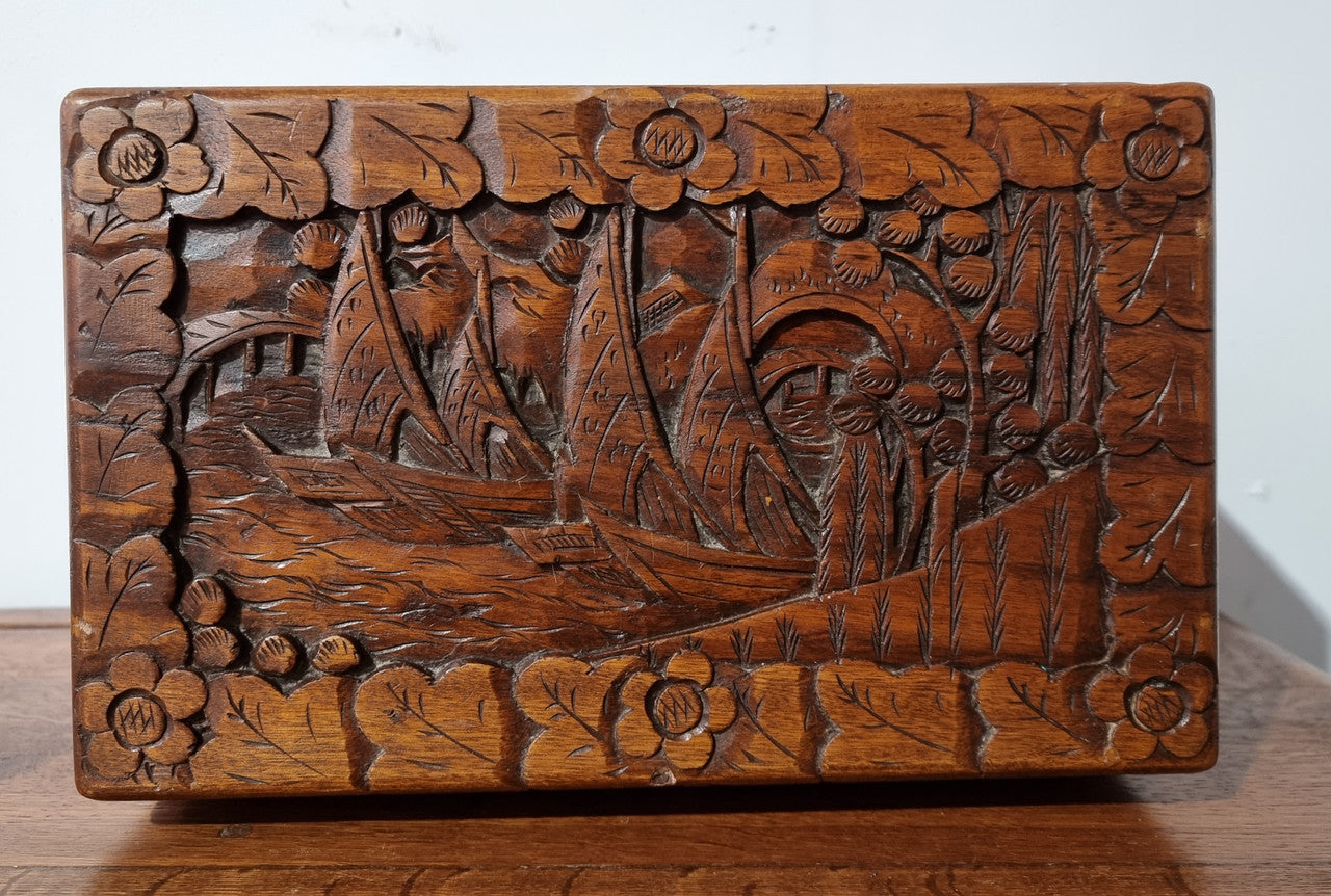 Small Chinese carved camphor wood jewellery box. It is in original condition.