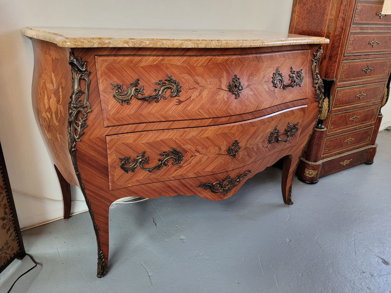 French Louis XV style marquetry inlaid two drawer marble top commode with deorative ormolu trim. In good original detailed condition with working double lock and key.