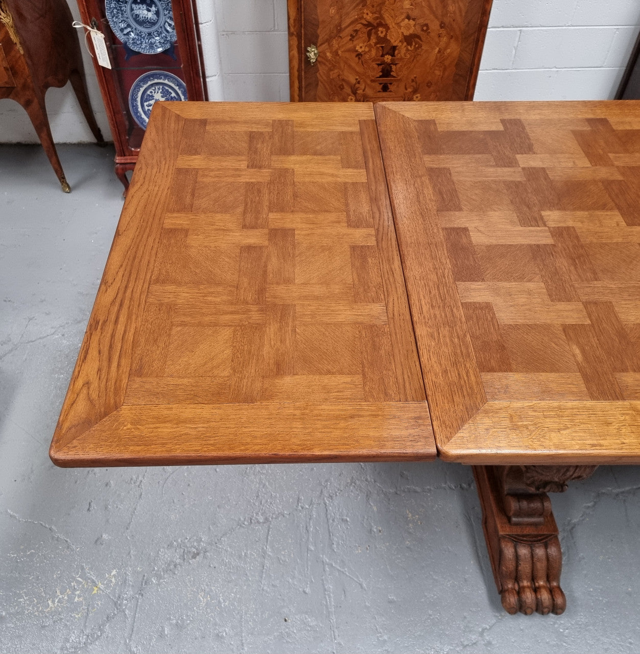 Amazing French Oak Renaissance style parquetry top extension table. Beautiful parquetry top and amazing detailed carvings on the legs. It extends to 306 cm long when fully extended. Sourced from France and in good original detailed condition.