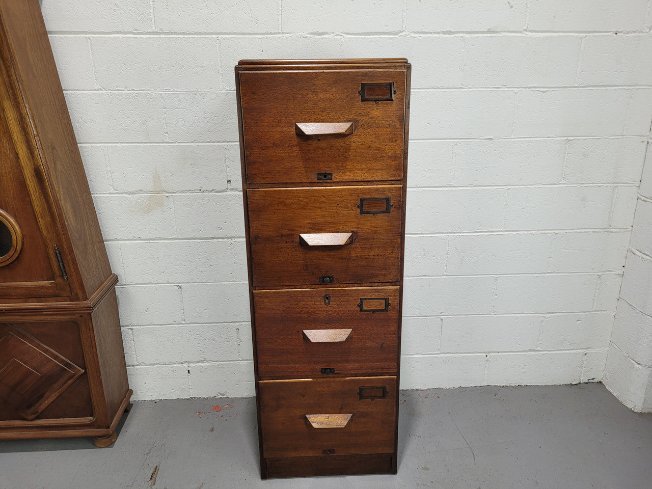 Blackwood four drawer filing cabinet in good original detailed condition.