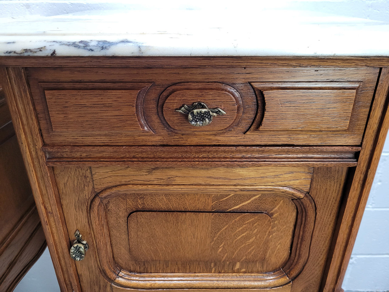 Pair of Louis XV style bedside cabinets with beautiful marble tops and one drawer and single cupboard for all your storage needs. In good original detailed condition.