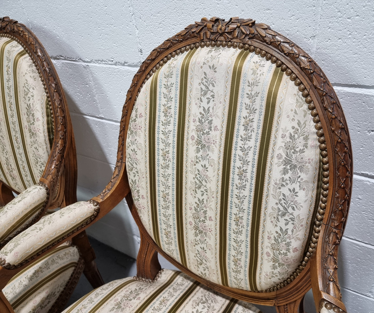 Pair of French Louis XV matching carved armchairs. They are in good overall condition with some slight wear to fabric, please view photos as they help form part of the description.