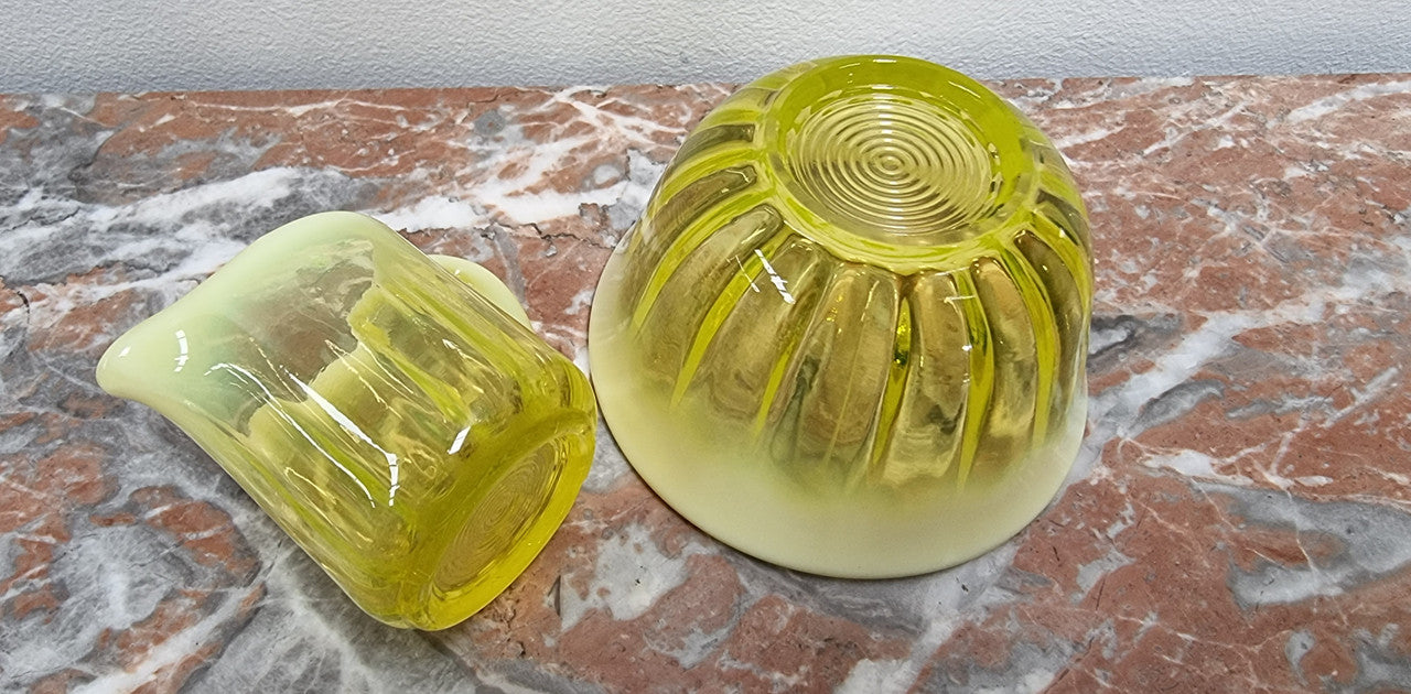 A fabulous rare Vaseline glass small jug and sugar bowl in good original condition.