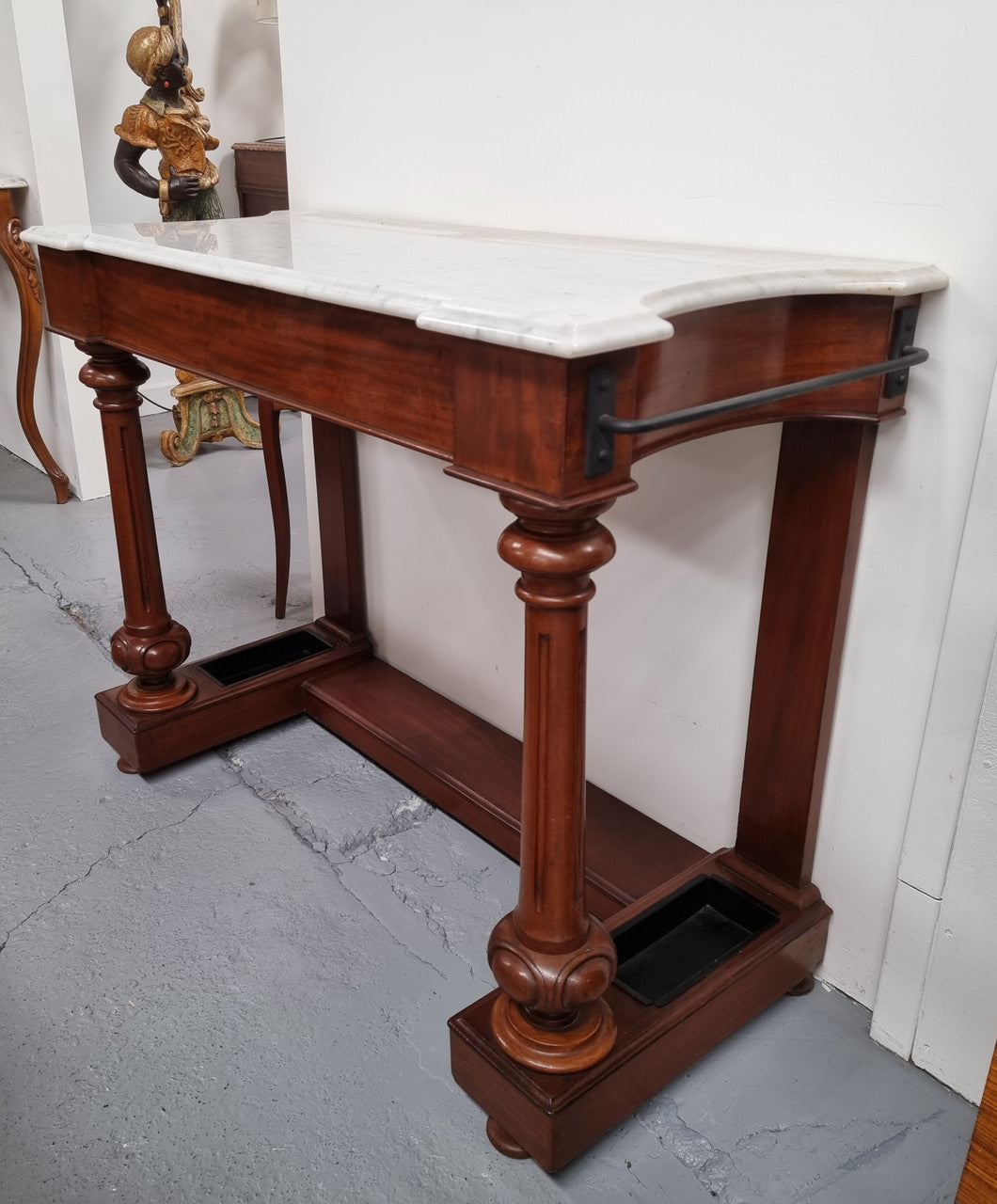 Classic Victorian mahogany console table with white marble top, one drawer and accommodation for sticks/umbrellas. In good original detailed condition.