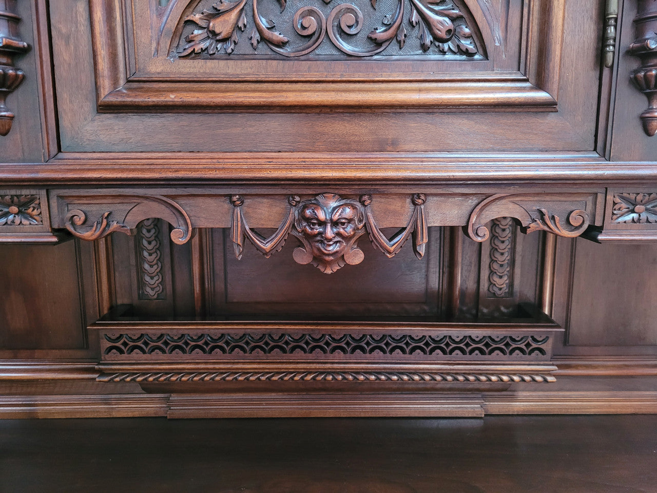 Spectacular French Walnut Renaissance Style buffet with amazing detailed carvings. Plenty of storage space with five cupboards and two large drawers. The three top cupboards open up to two adjustable shelves in each section and the two bottom drawers open up to one large fully adjustable shelve. In good original detailed condition.