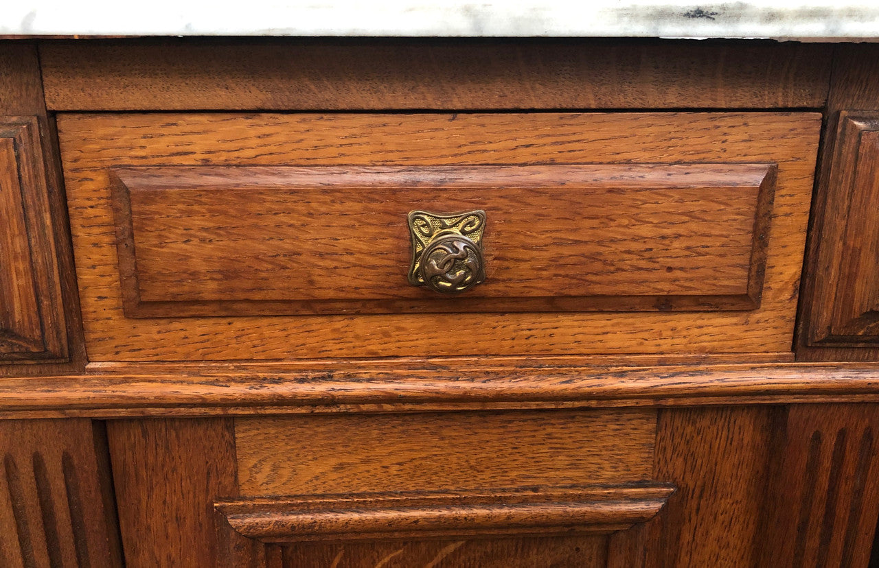 A lovely pair of French Oak, marble top bedside cabinets with a cupboard and drawer in good original condition.