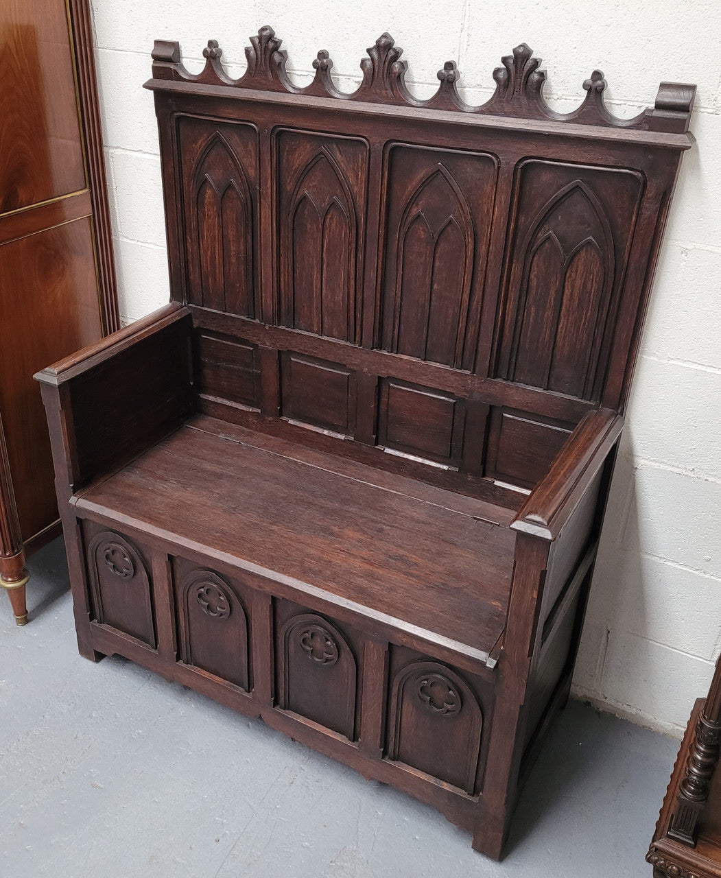 French Oak 19th Century gothic style high backed hall seat. Amazing detailed carving and is good detailed condition.