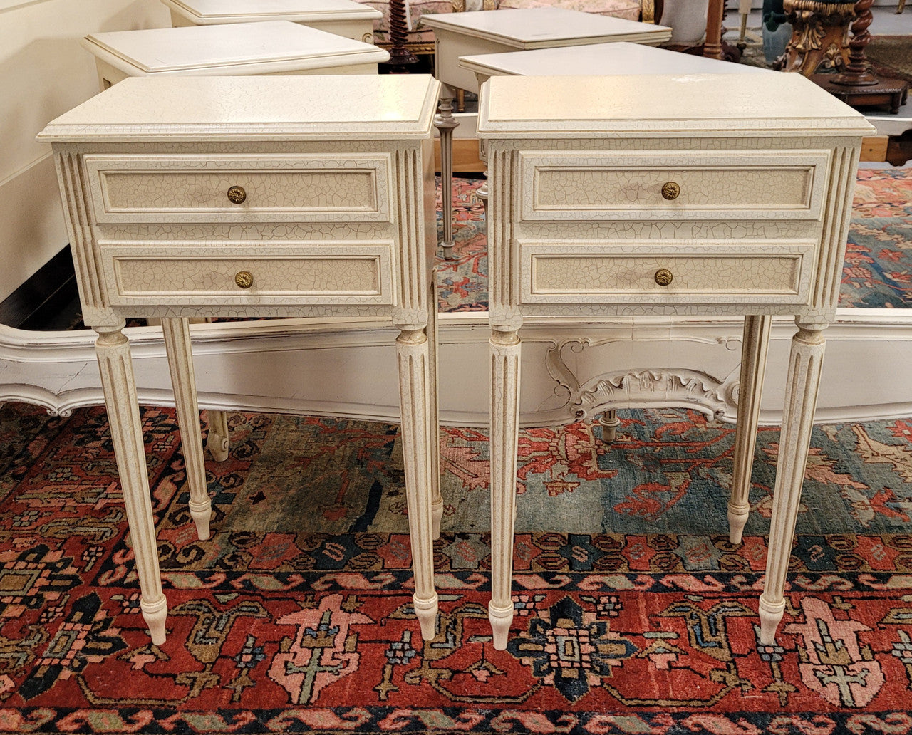 Pair of Vintage Louis 16th style painted crackle finish two drawer French style bedsides. They have elegant reeded legs and have been sourced from France. They are in good original condition.