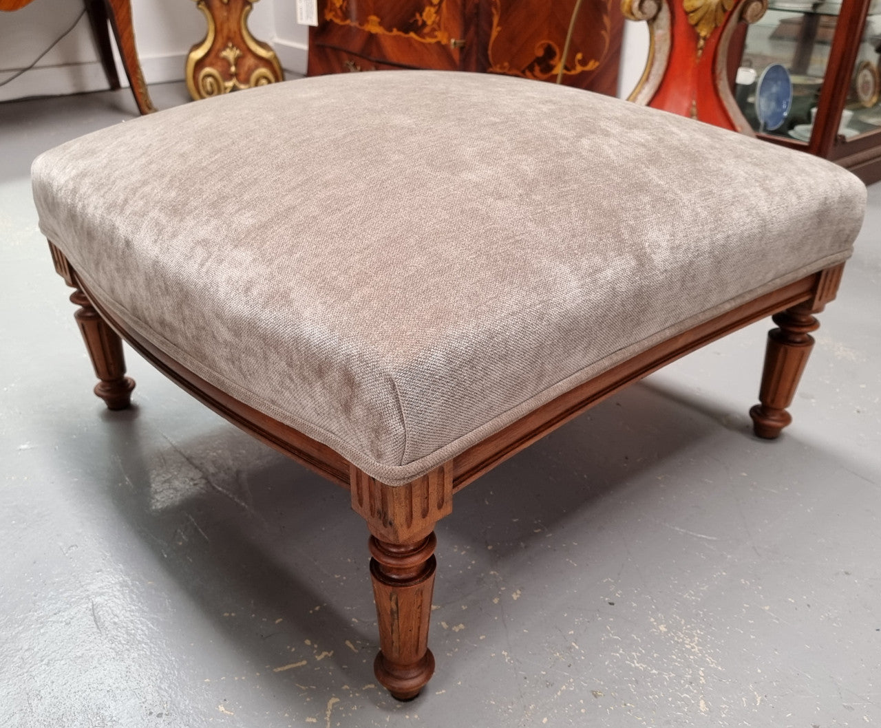 Lovely French Louis 16th style large walnut footstool with light grey upholstery. Circa:1900. In good detailed condition.
