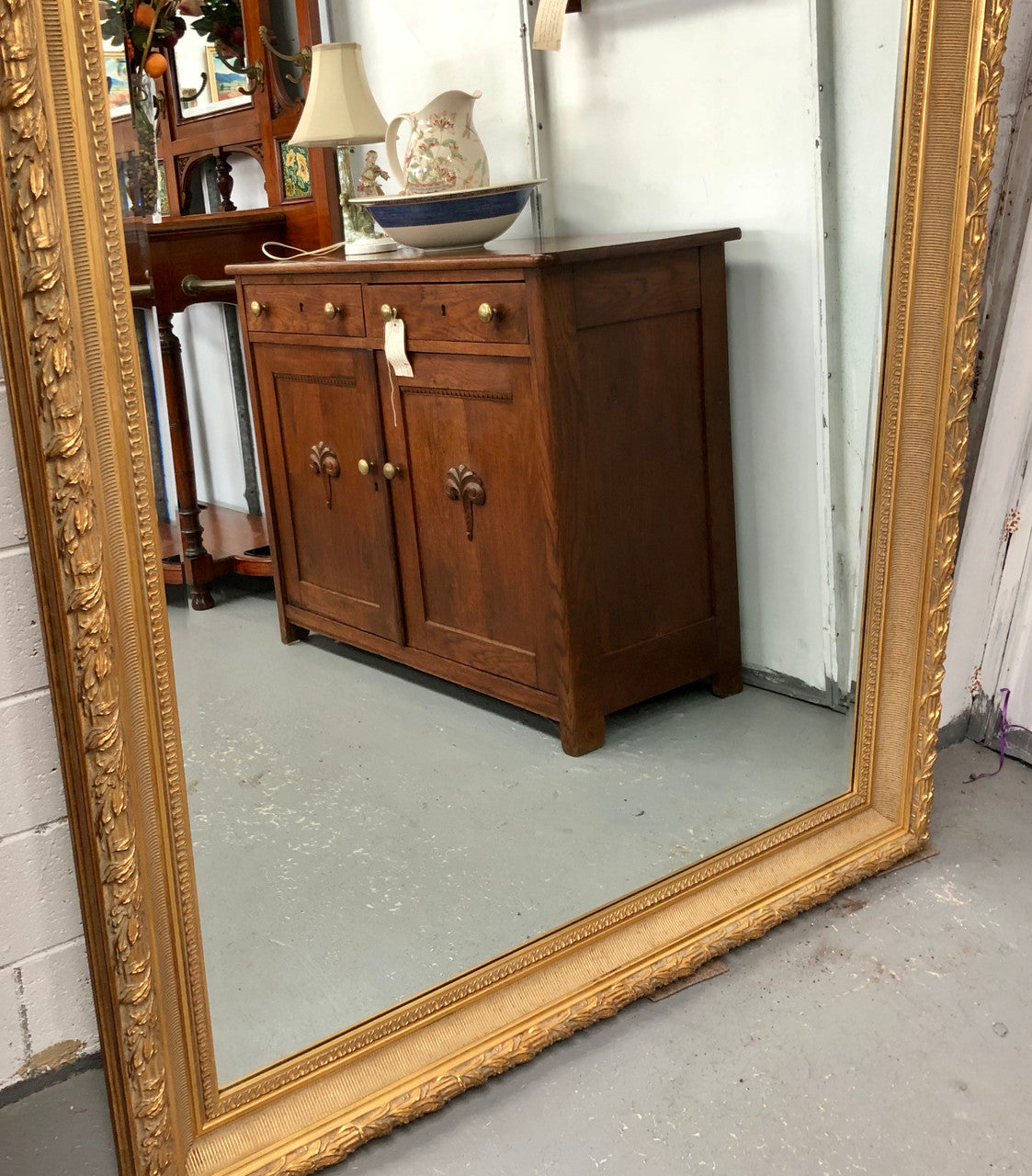 Very large French style mirror with beveled glass. In very good original condition.