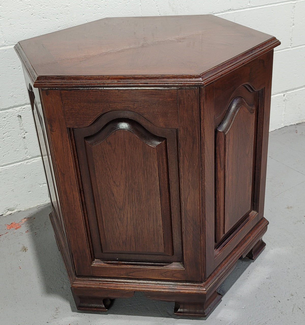 Hexagonal Mahogany enclosed side cabinet with two doors. Would make an ideal side cabinet and is in good restored condition.