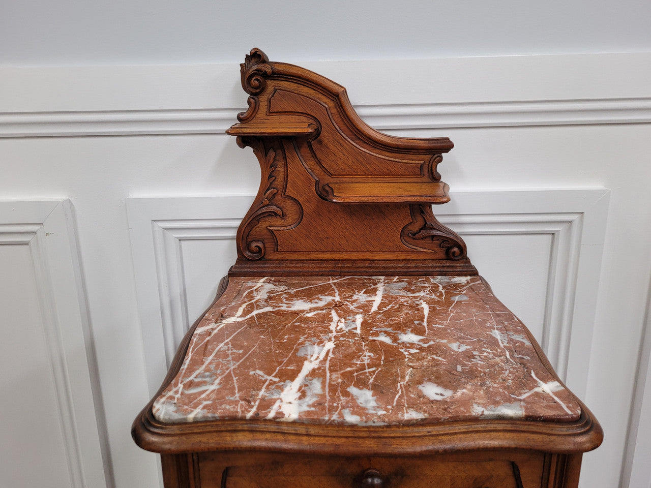 French Louis XV style Walnut single bedside cupboard with inset marble top. It has been sourced from France and is in good original detailed condition.