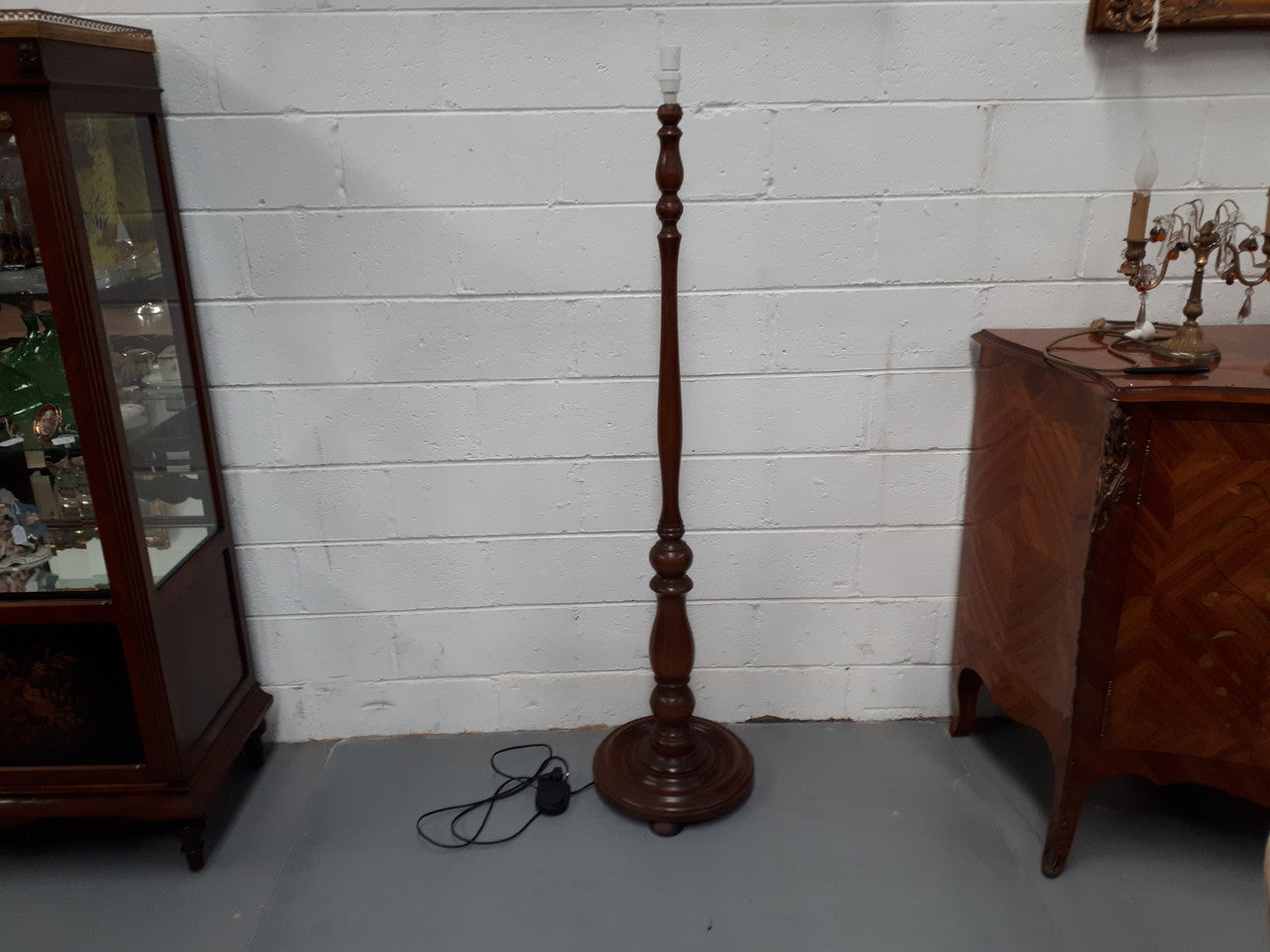 Antique Walnut standard lamp, with foot switch and in good working order condition.