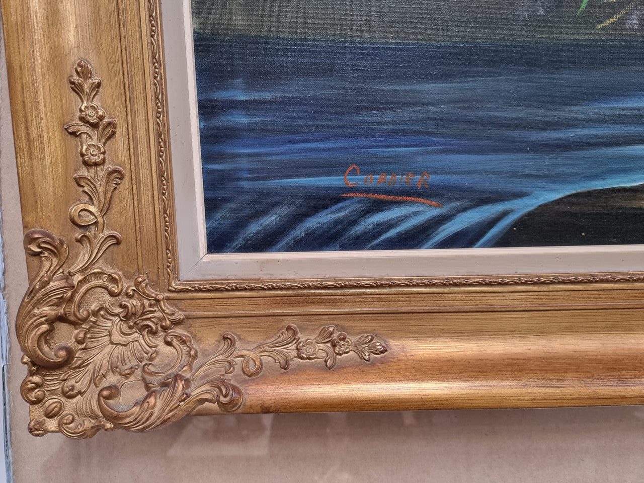 Sourced from France a stunning colorful floral oil painting on canvas. It is in a decorative gilt frame and is signed. It is in good original detailed condition.