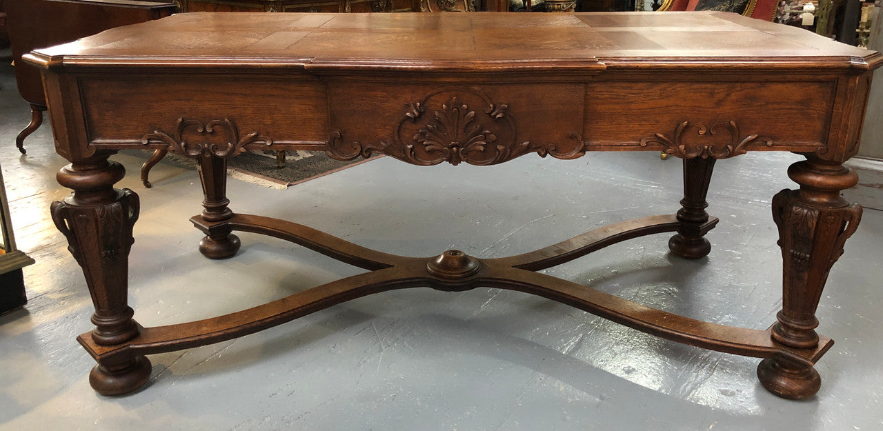 Beautifully carved 19th century French oak Bureau Plat. With a lovely parquetry top and two drawers and decorative carved legs this piece is definitely one to look at . In good original detailed condition.