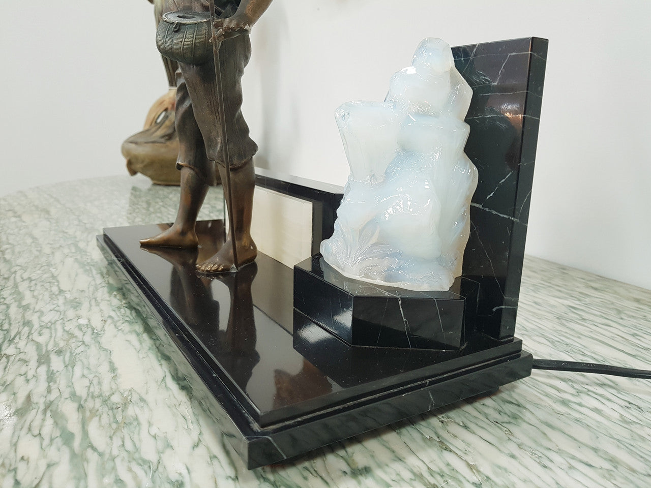 An amazing French Art Deco boy fishing statue with a Vaseline light shade. It is in fantastic working condition on a lovely marble base.