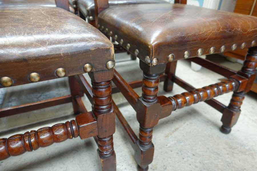 Here we have a fabulous set of six French oak rustic leather dining chairs with two carvers. Chairs are upholstered in brown leather and are very comfortable and solid. Is in very good original condition.