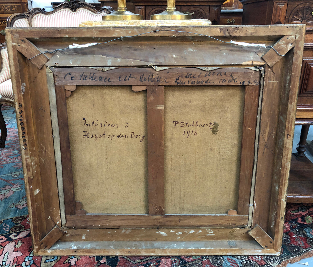 Antique French gilt framed signed oil on canvas of an interior scene in good original condition.