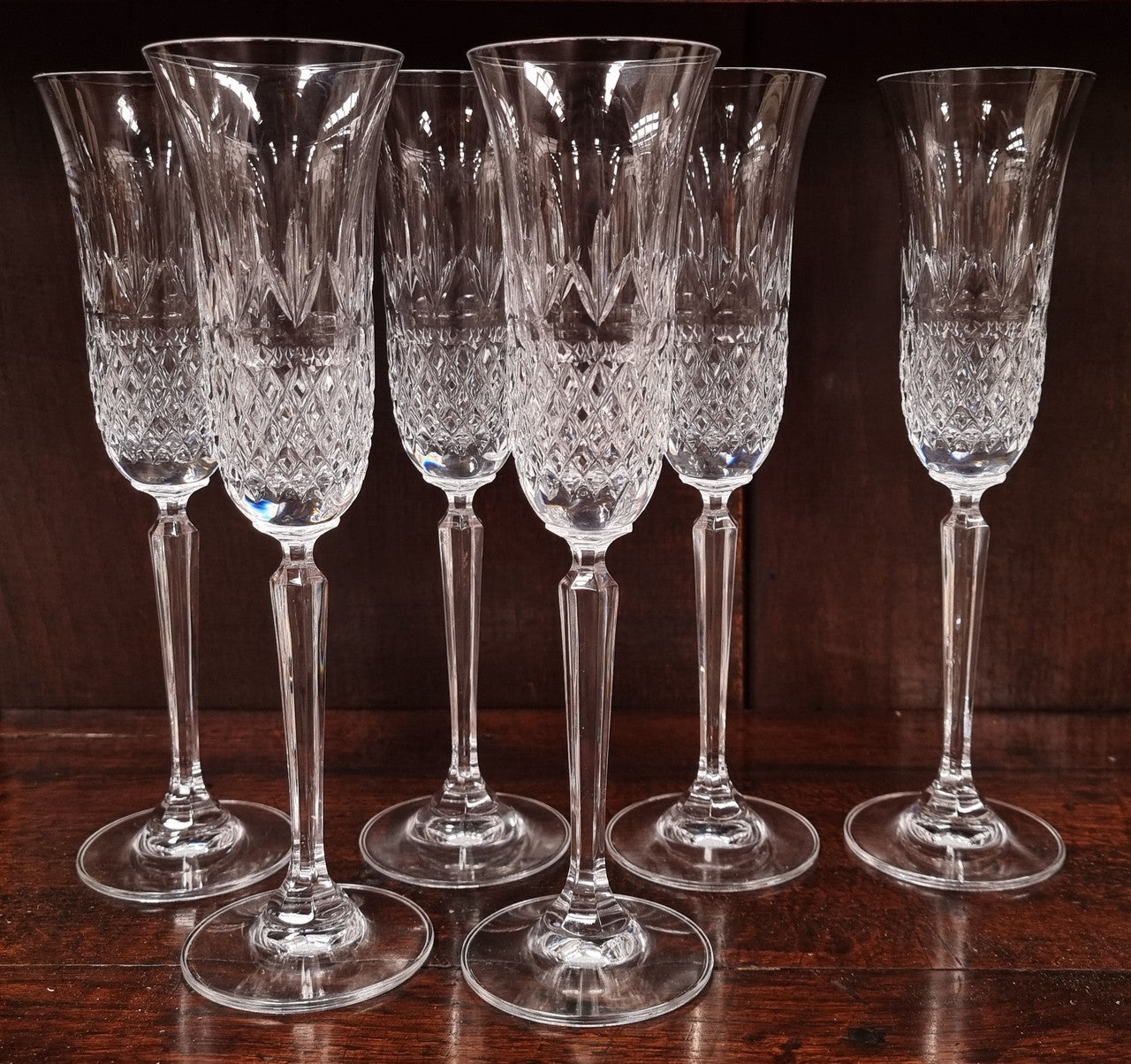 Set of eight crystal champagne glasses. In good original condition.