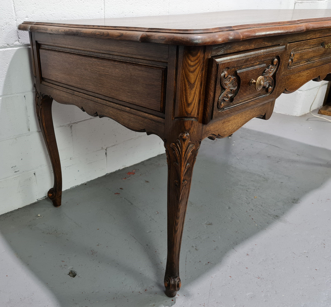Attractive large Louis XV style Oak faux partners desk. Nicely carved details with three large functioning drawers, and three faux drawers at the back. In good original detailed condition.