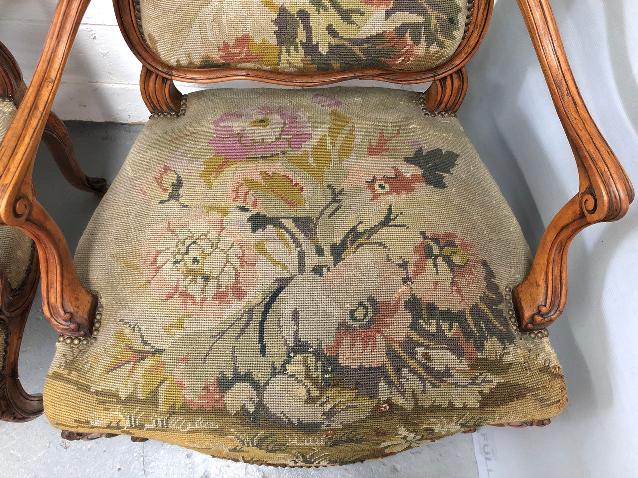 Pair of French Walnut Tapestry covered armchairs. They are in good original detailed condition. Slight wear and tear to fabric but still in good condition please view photos.