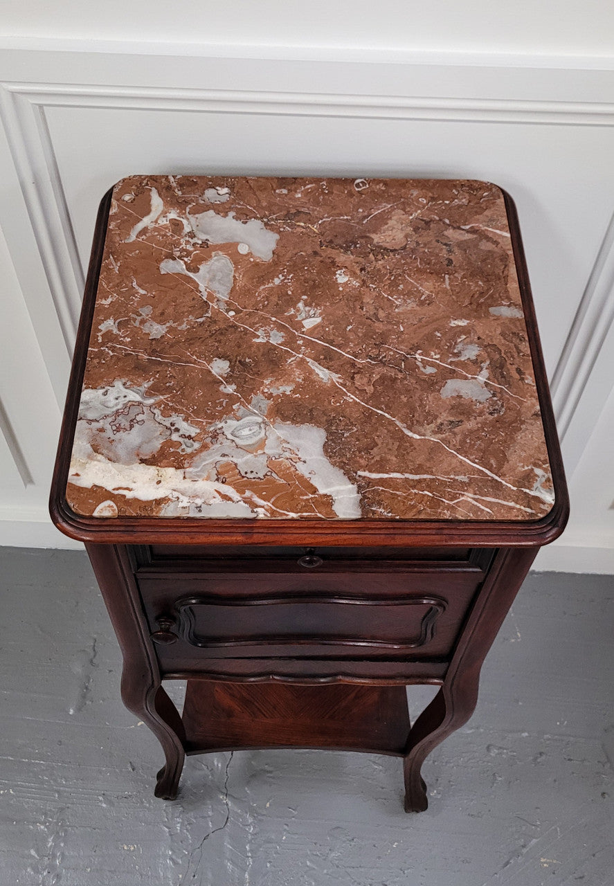 French Rosewood inset marble top single bedside cabinet with one drawer and one cupboard on elegant legs. Would also make a practical and stunning table lamp. It is in good original detailed condition.