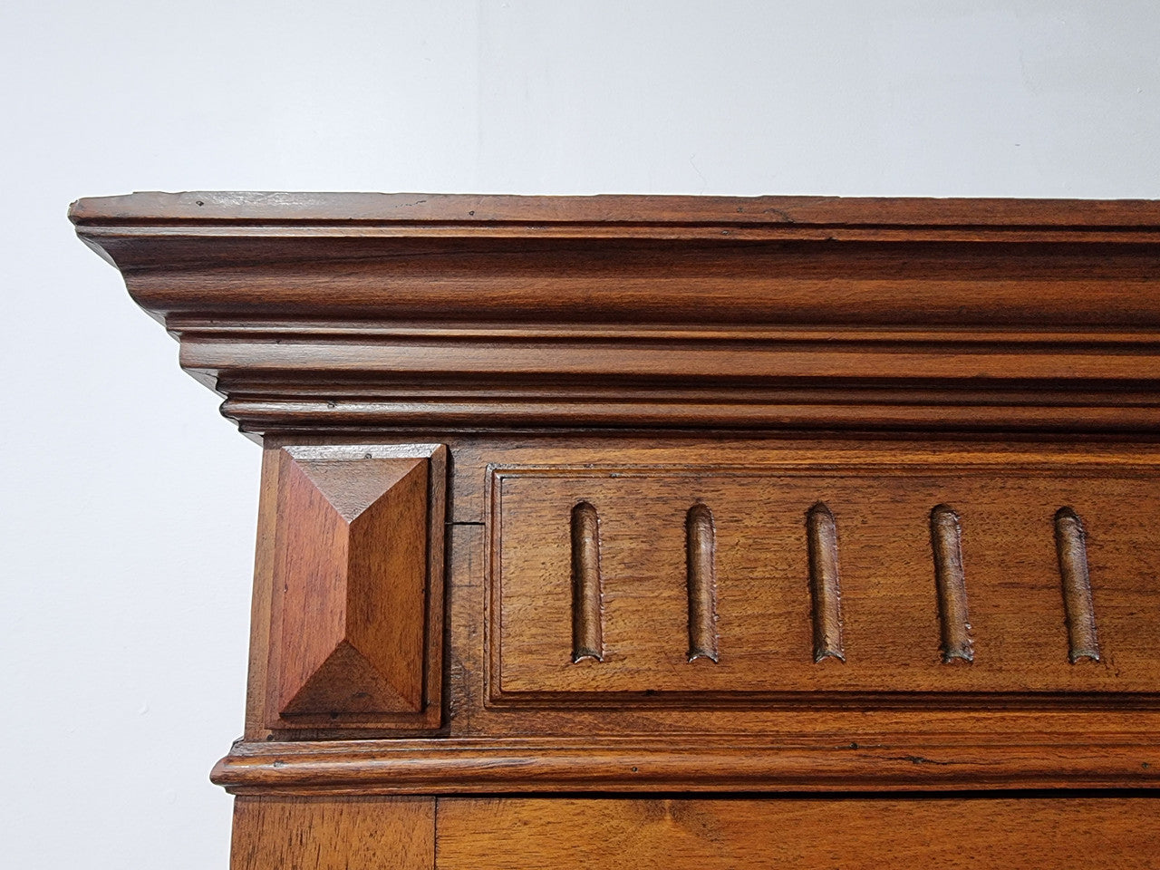French Henry II style Walnut linen storage cupboard with nine pull out shelves. This piece could be very functional for a range of different purposes including shoe storage. It is in good original detailed condition, please note the door lock no longer functions and opens by pulling the door.