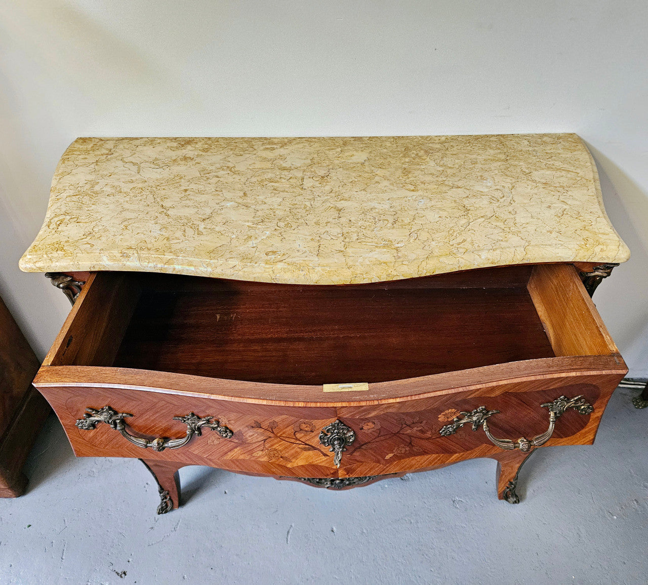Stunning French Louis 15th style marble topped three drawer commode with marquetry inlay and stunning ormolu mounts. In good original detailed condition.