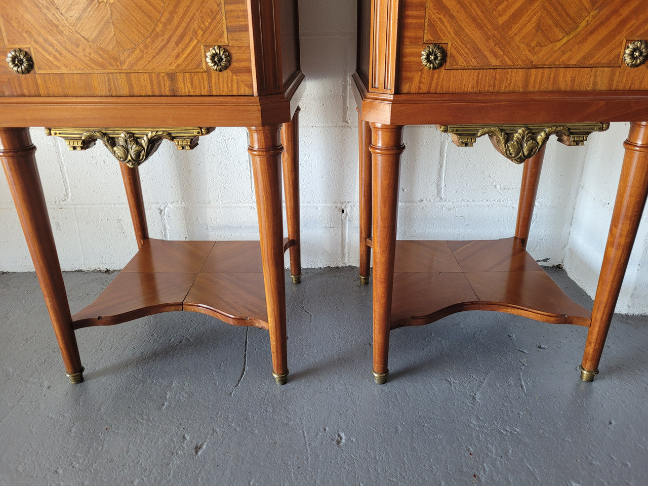 Pair of Louis XVI style Mahogany marquetry inlaid marble top bedside cabinets. Circa 1900 and in good original condition.