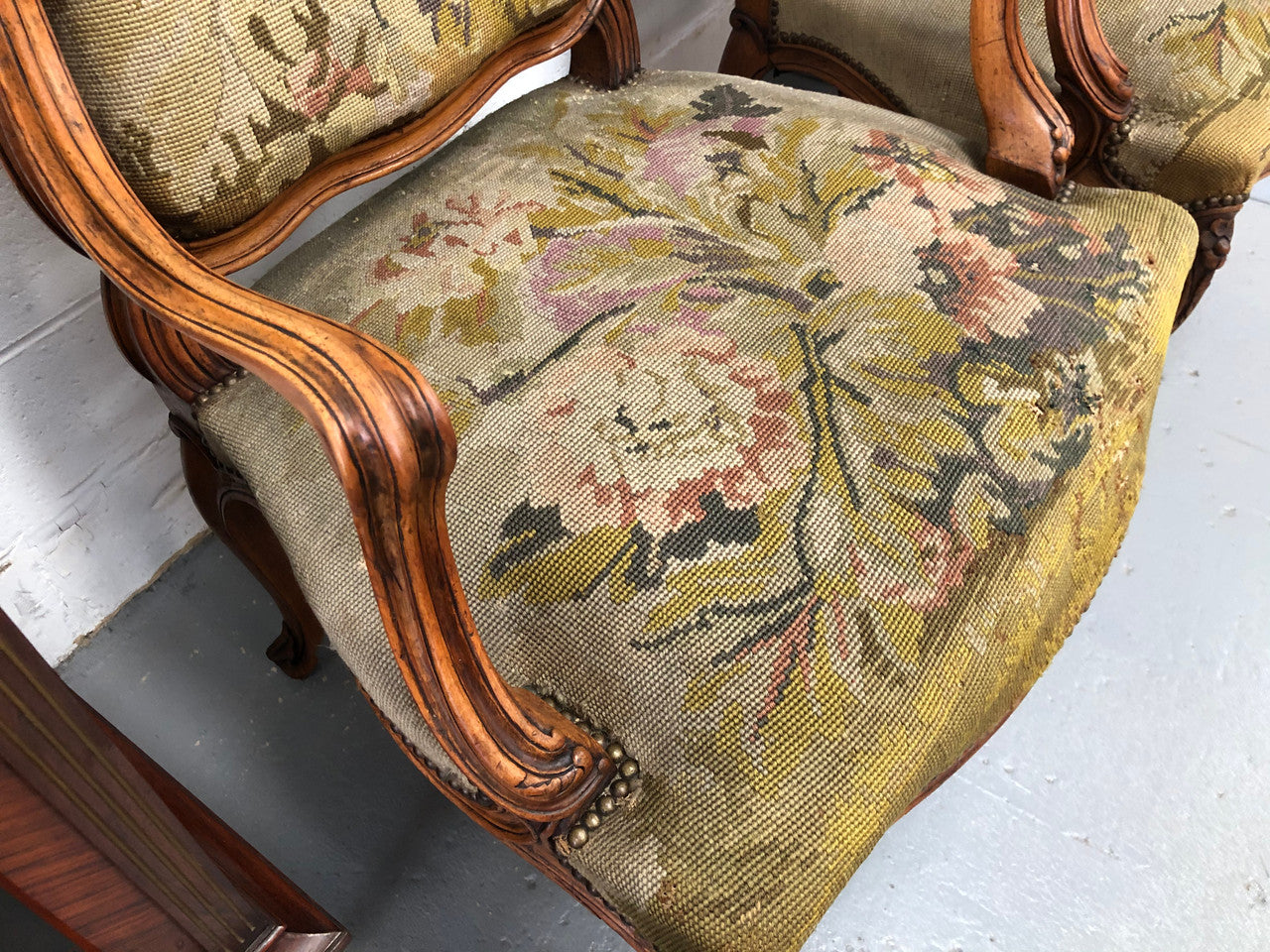 Pair of French Walnut Tapestry covered armchairs. They are in good original detailed condition. Slight wear and tear to fabric but still in good condition please view photos.