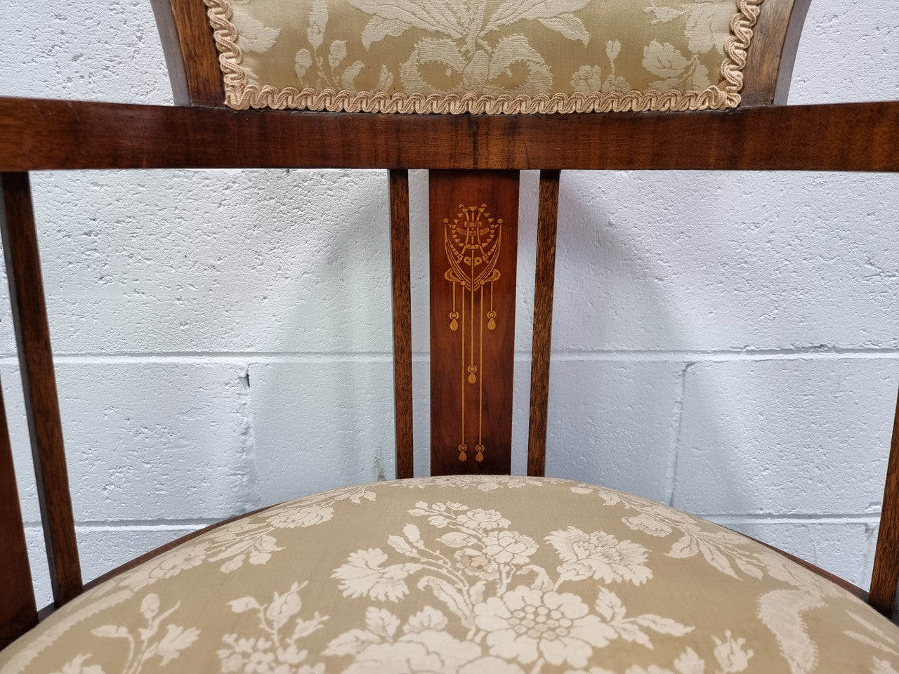 Charming Edwardian inlaid walnut upholstered armchair. In good original condition.