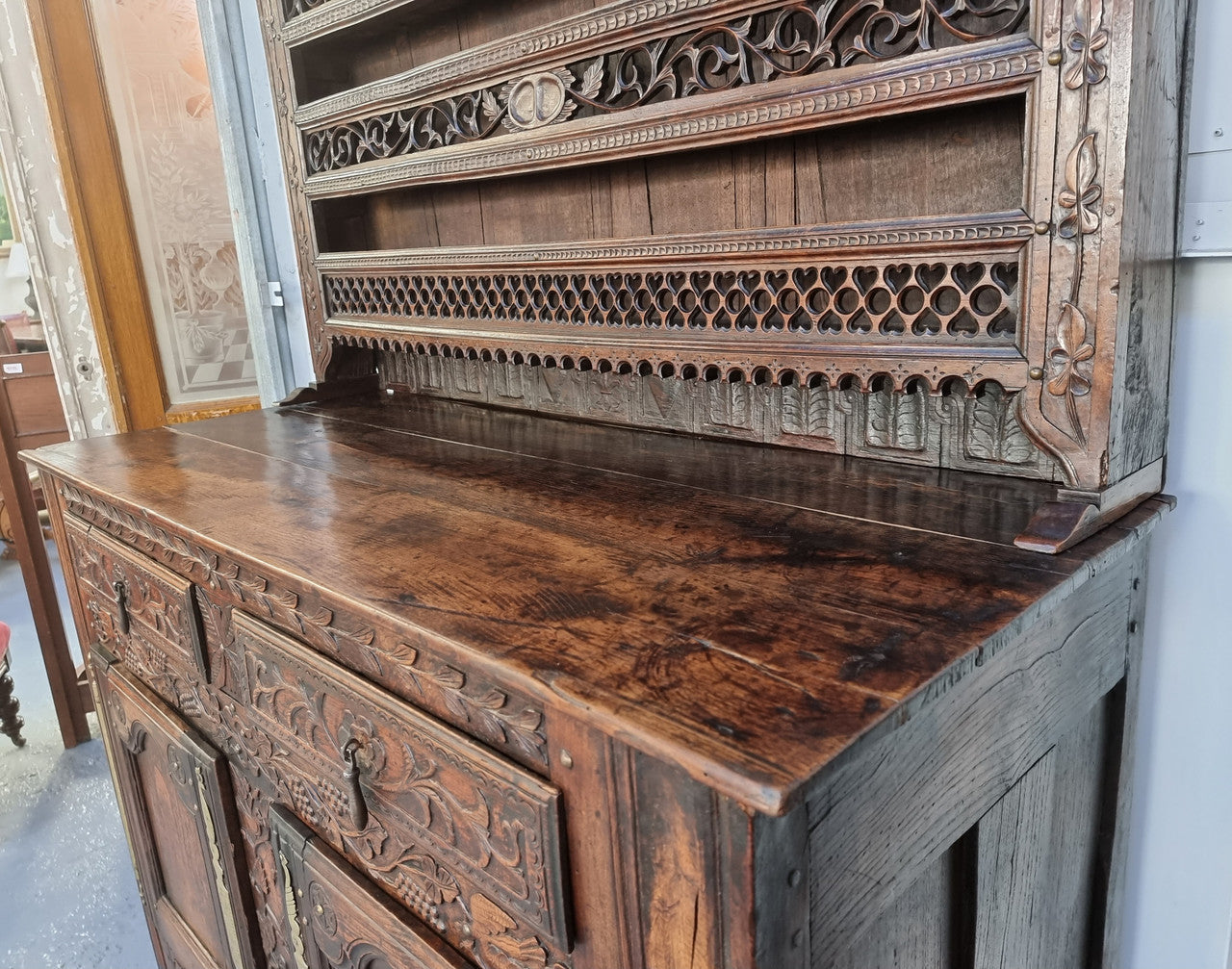 Absolutely stunning French early 18th century kitchen dresser/Vaisselier with beautiful carving and cupboards for storage . The top carved section has four shelves for display and is in good original detailed condition.