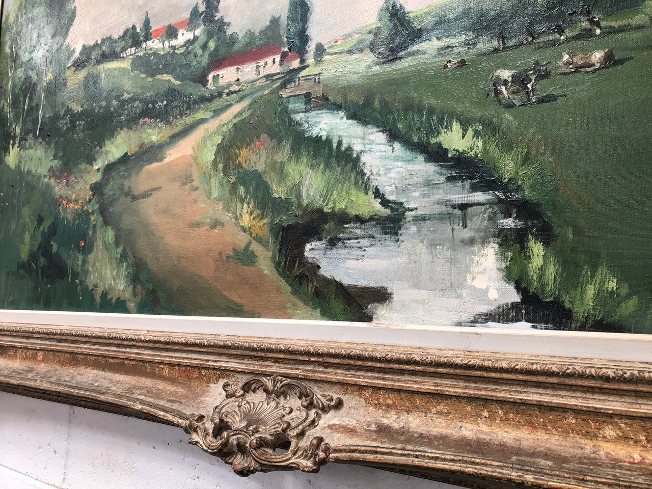 Lovely framed French signed oil on canvas of a country scene in a ornate decorative frame and is in good original condition.