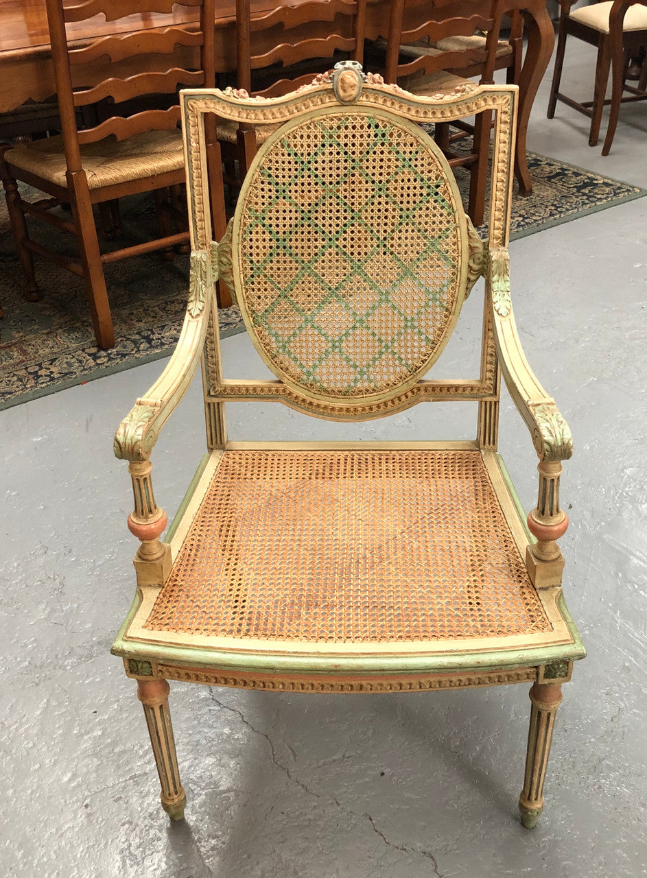 Painted French Louis XVI style cane panel arm chair. Paint is original and it is in very good original condition.