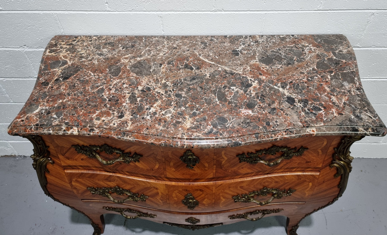 Attractive French marble top Louis XV style three drawer commode with decorative ormolu mounts. In good original detailed condition.