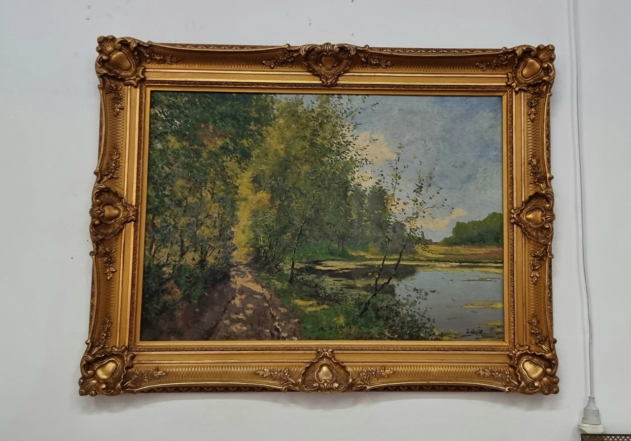 Sourced in France is this beautiful impressionist oil on canvas by "LOUIS GAROT". In a lovely ornate frame, signed and in good original condition.