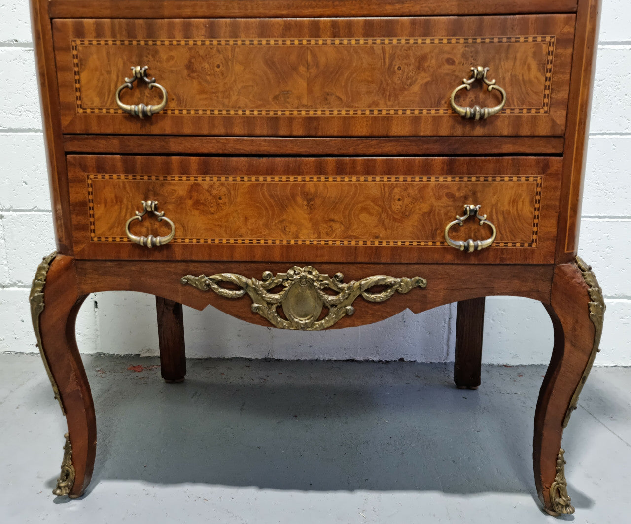 Louis XV style parquetry inlaid marble top semainier. It has seven drawers and a stunning coloured marble top. In good original condition.