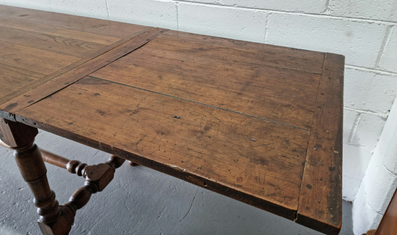 Appealing and rare French Oak Farmhouse extension table. Charming character to the top and comfortably seats 12 people. In good original detailed condition.