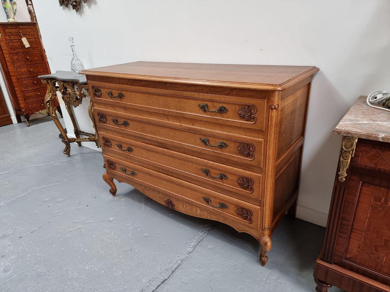 Fabulous French light Oak of chest of four drawers with lovely decorative carving. In good original detailed condition.
