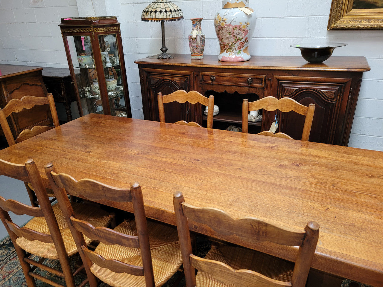 French Farmhouse table with a beautiful thick plank top and stretcher base. Can seat 8-10 people comfortably and is in good original detailed condition.