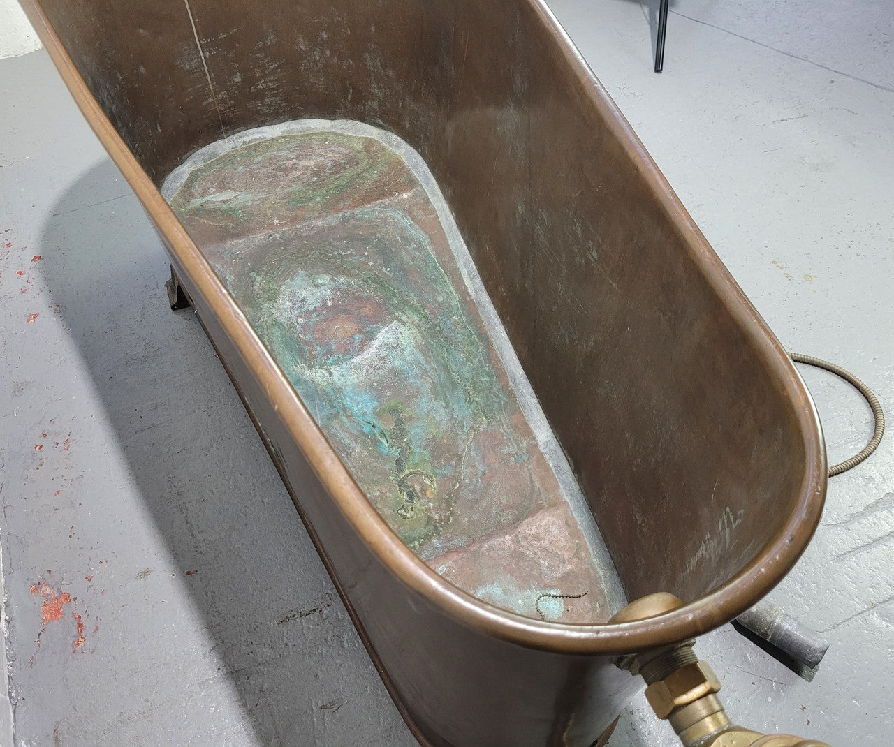 Sourced from France a rare full copper Antique bath tub on feet and includes an overflow, fittings, taps ect. In good original condition.
