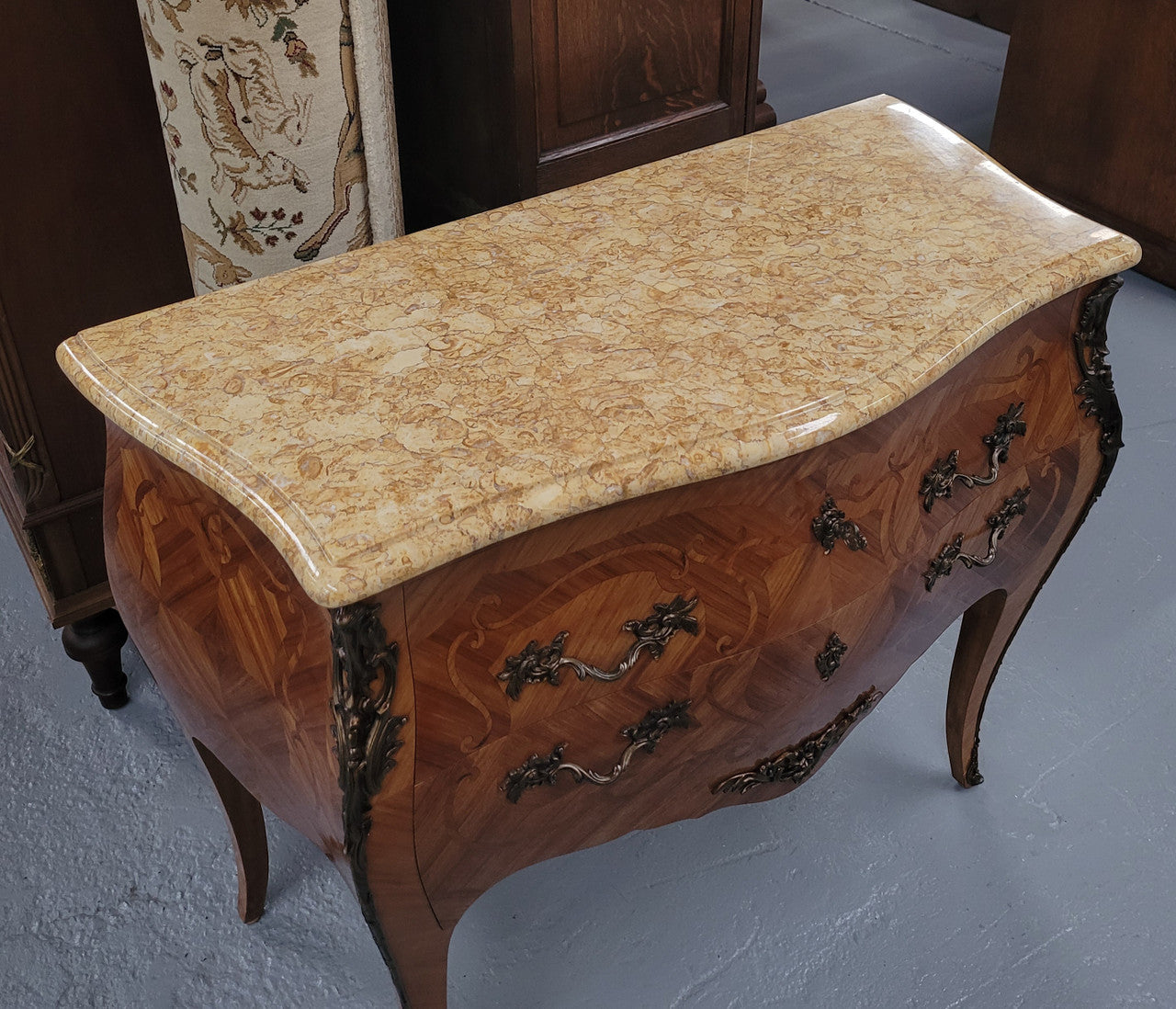 An elegant French Louis XV style kingwood two drawer commode with beautiful decorative inlay and ormolu mounts. Stunning coloured marble top and is in good original detailed condition.