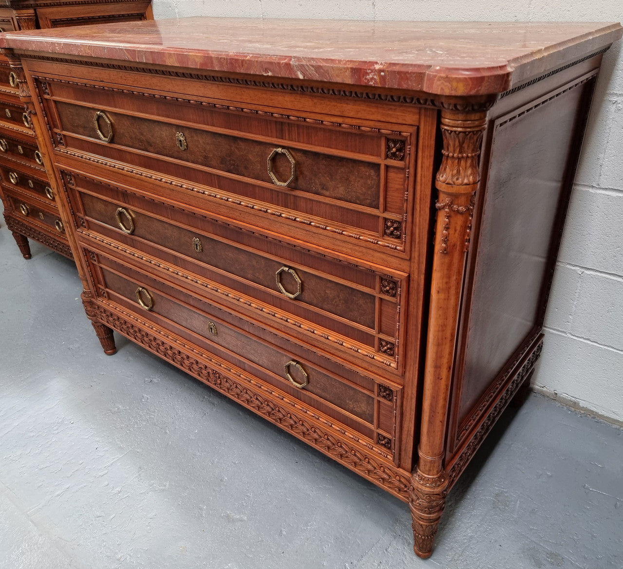 Lovely decorative French walnut and burr Walnut 3 drawer commode with a stunning coloured marble top and lovely carved details. In very good detailed condition.