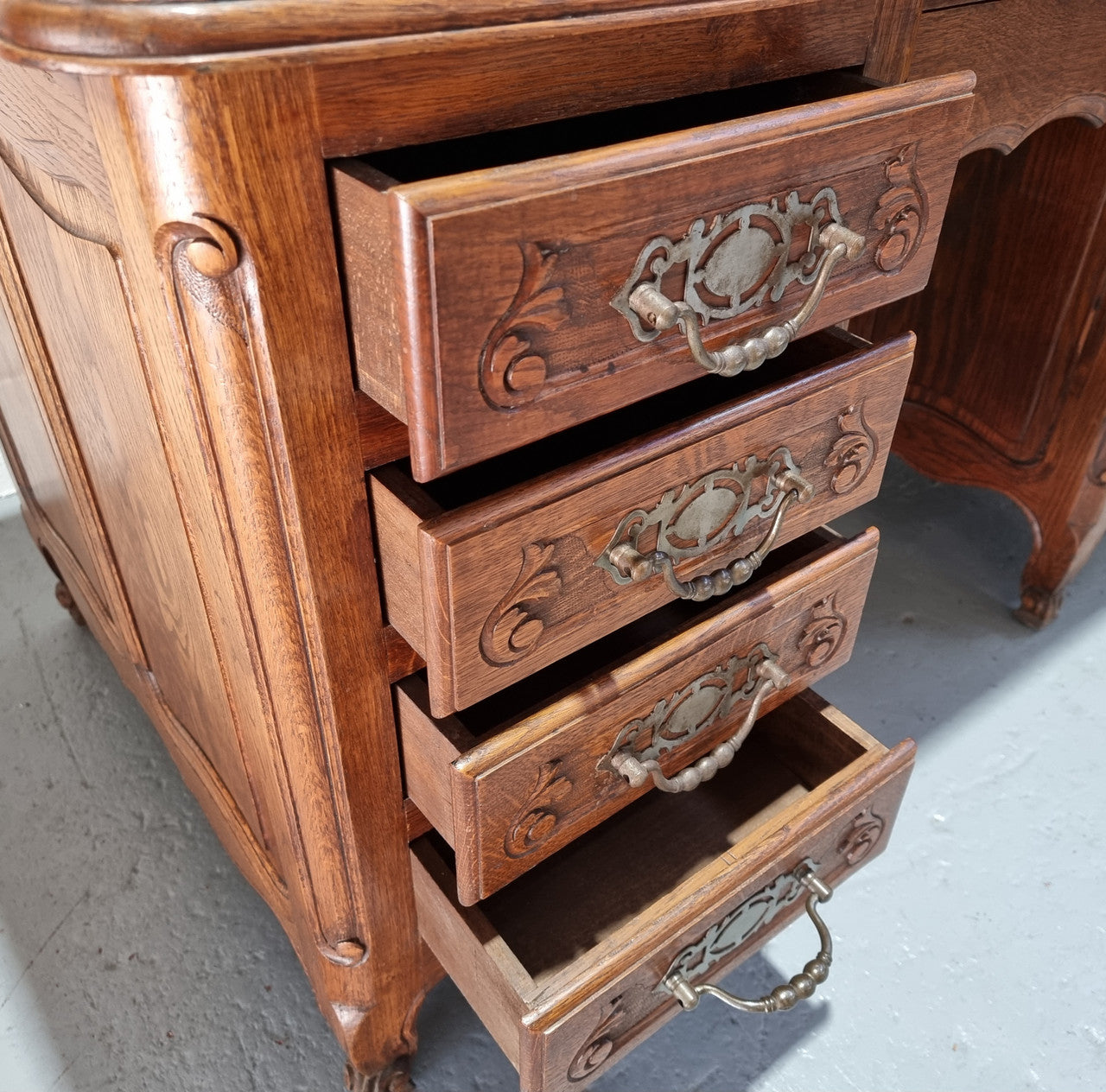 Beautifully carved french oak, faux partners desk with a lovely parquetry top and 6 drawers and 1 cupboard . In good original condition.