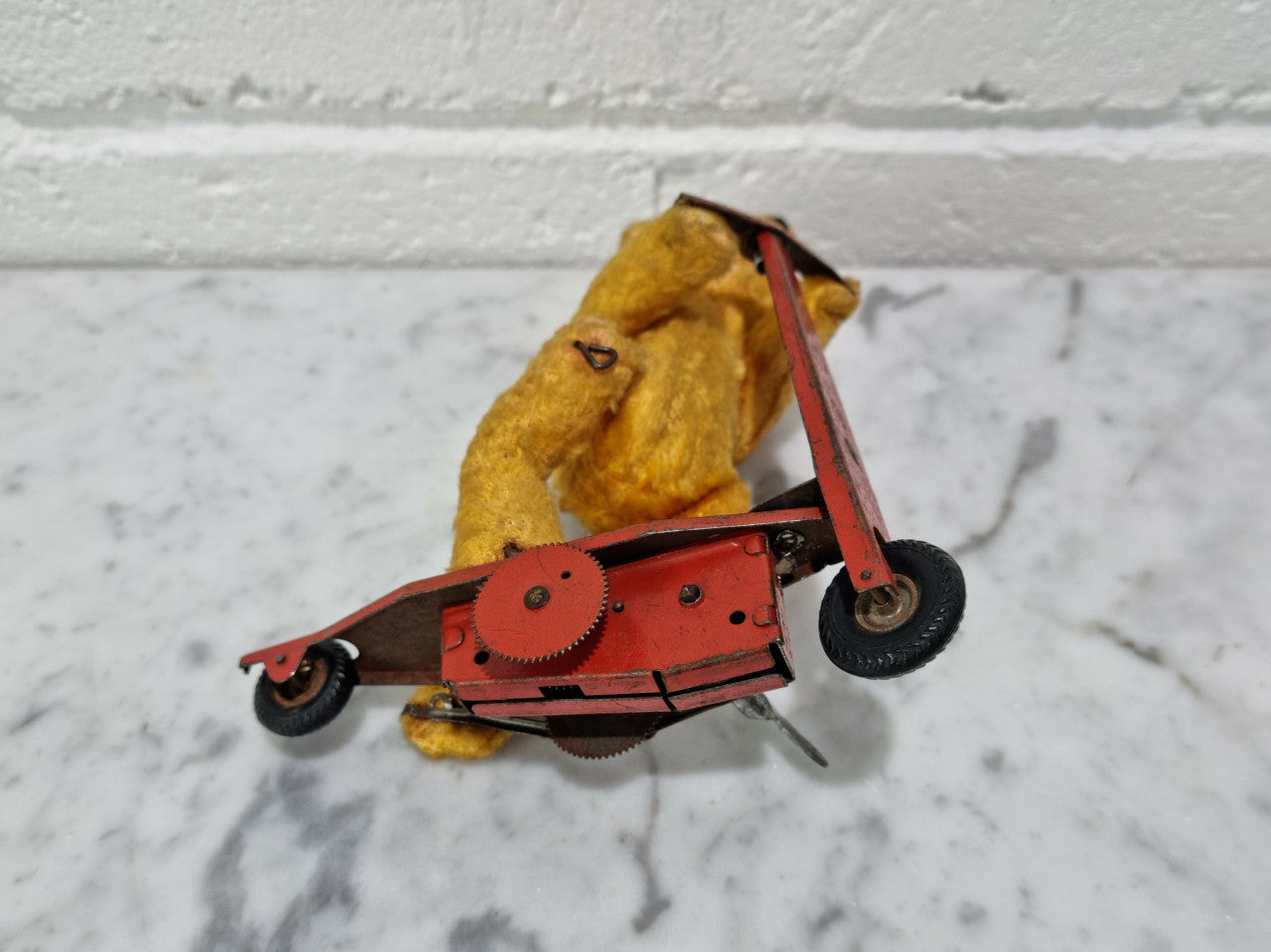 "Gebruder Fendi" bear riding scooter wind up toy, comes with original key. In good original condition, please view photos as they help form part of the description.