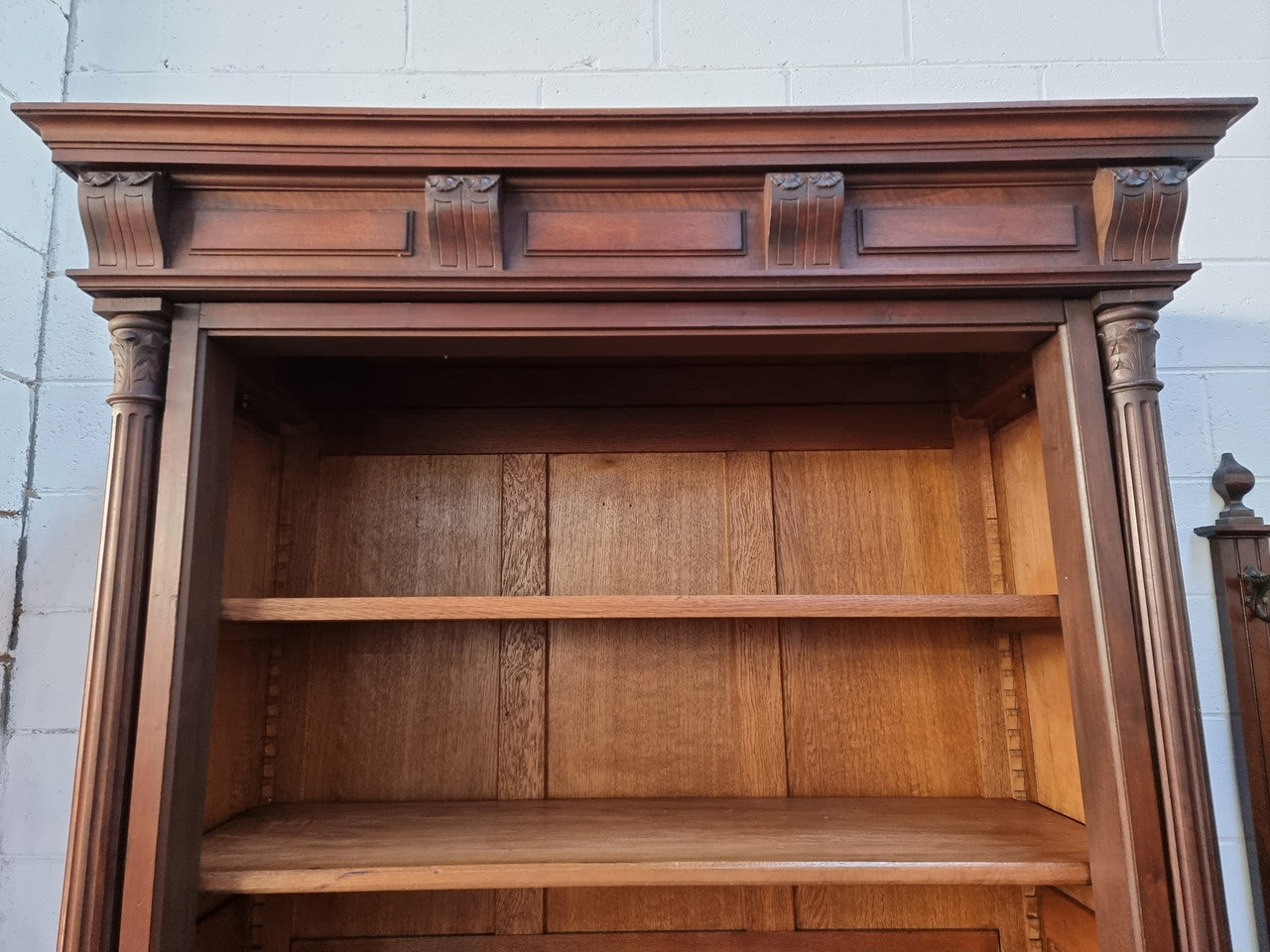 Henry II style 19th century walnut open bookcase with drawer which was originally an armoire now converted to a bookcase. It comes with four adjustable shelves. Is in good detailed condition.