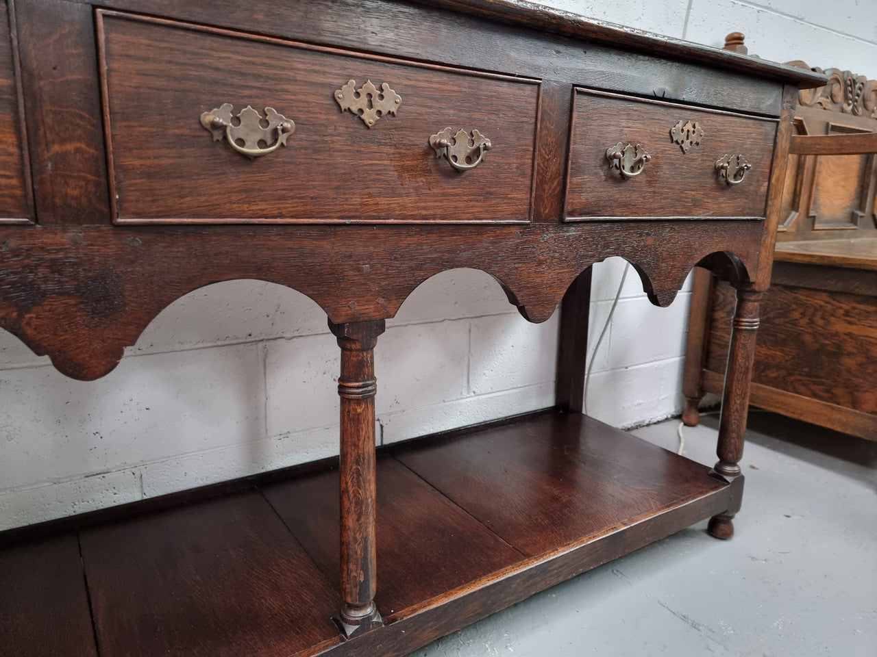Antique 19th Century English dark Oak three drawer Dresser with brass handles and in good original condition.