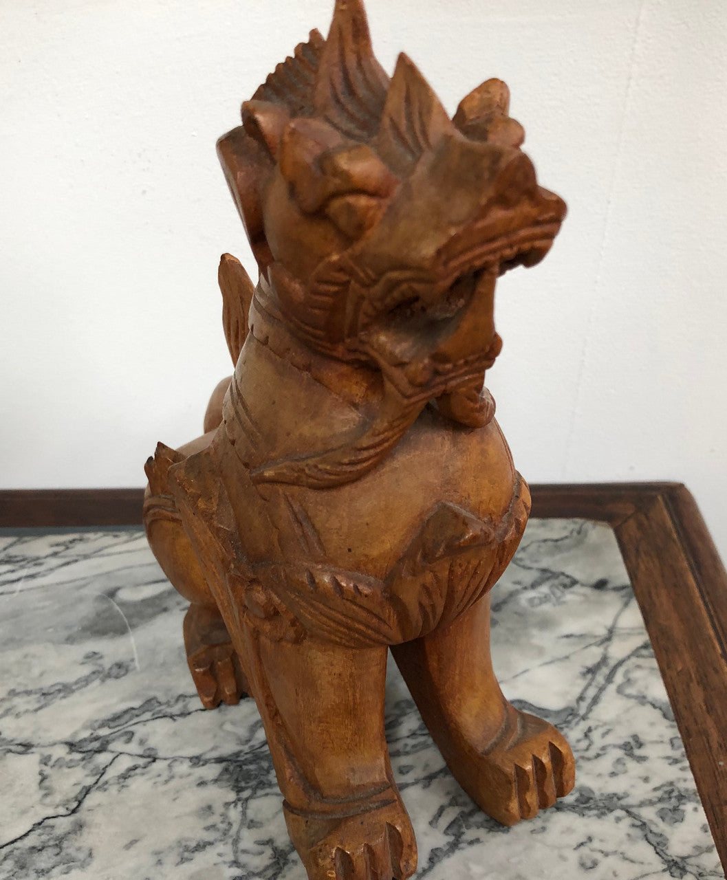 Chinese carved Teak Foo dog with very good detail. In good original condition.