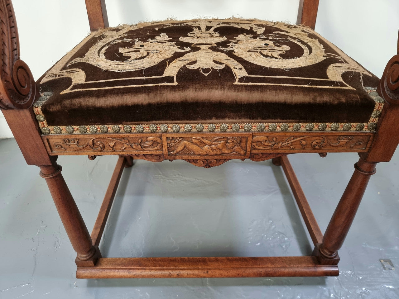 Beautifully carved Walnut Egyptian Revival armchair with amazing hand sewn Stumpwork embroidery coverings. In good original detailed condition.